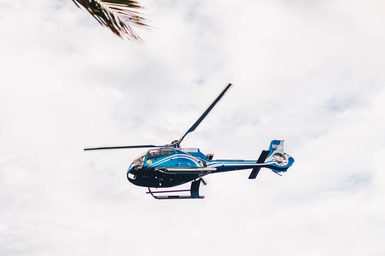 hovering blue helicopter
