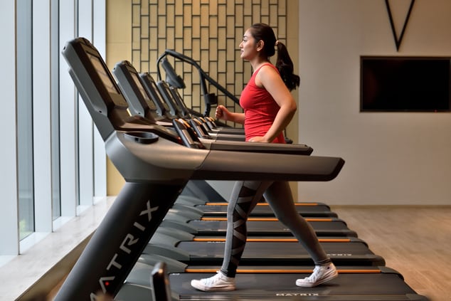 A woman walking on a treadmill
