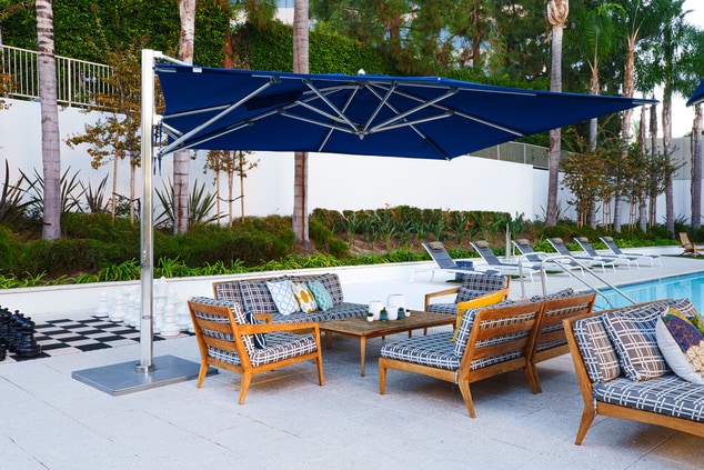 image of pool chairs and table poolside