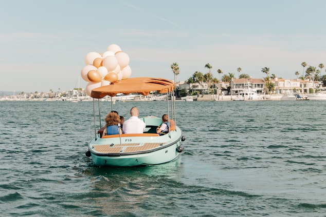 Family in a duffy boat on the harbor