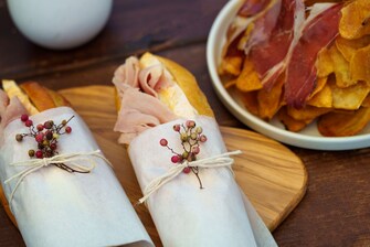 Ham and brie baguettes with iberico on chips