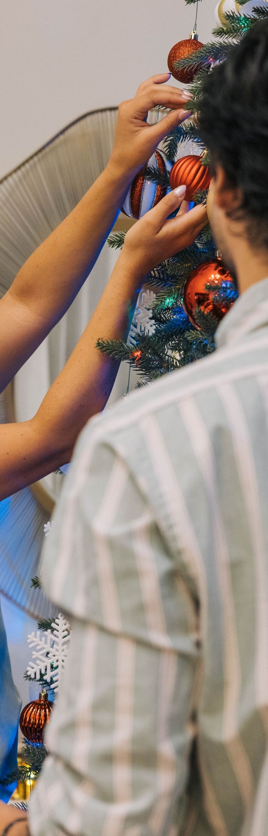 Couple Decorating Christmas Tree