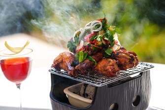 Smoking wings and a red cocktail