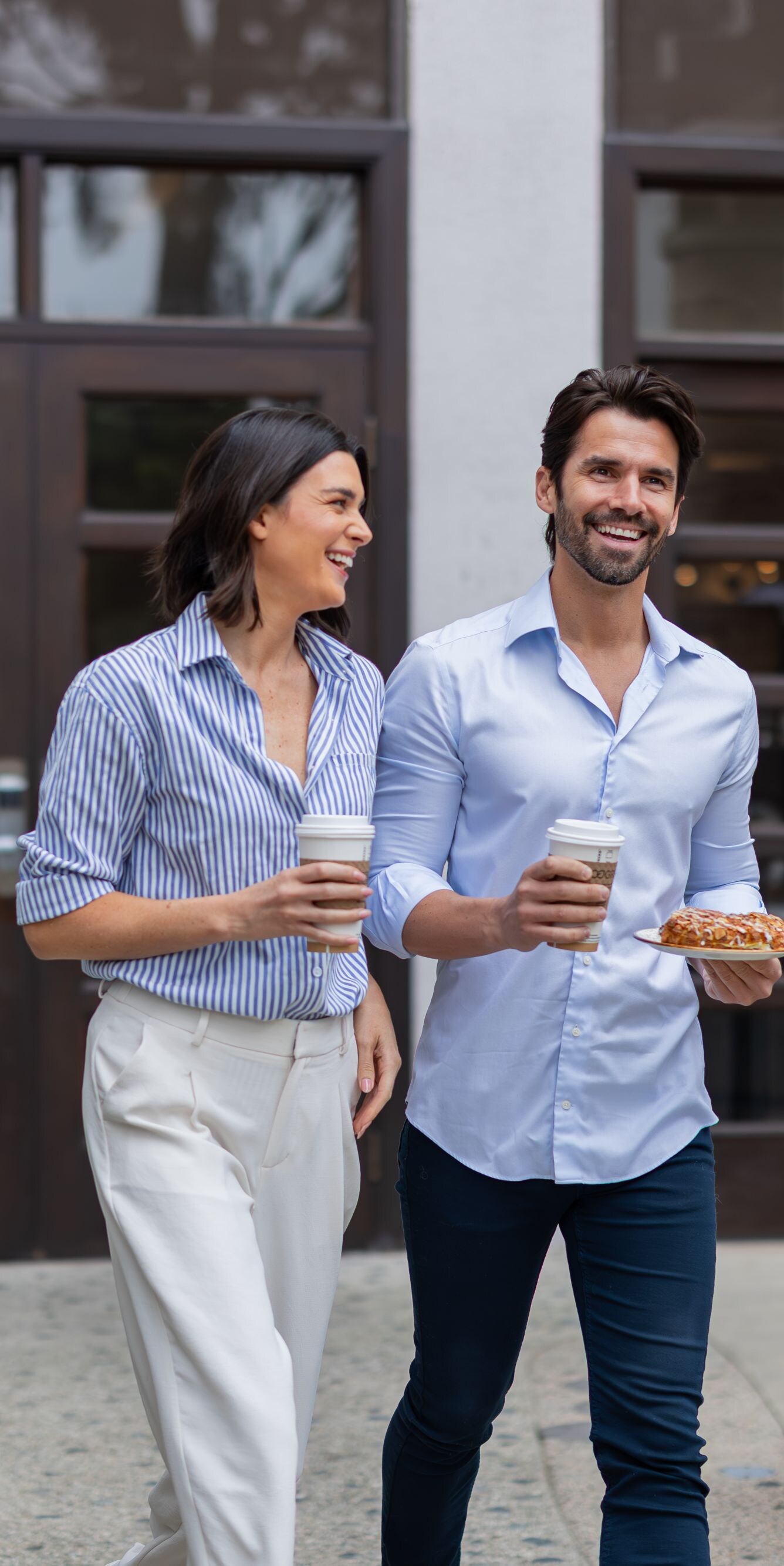 Couple walking with coffee
