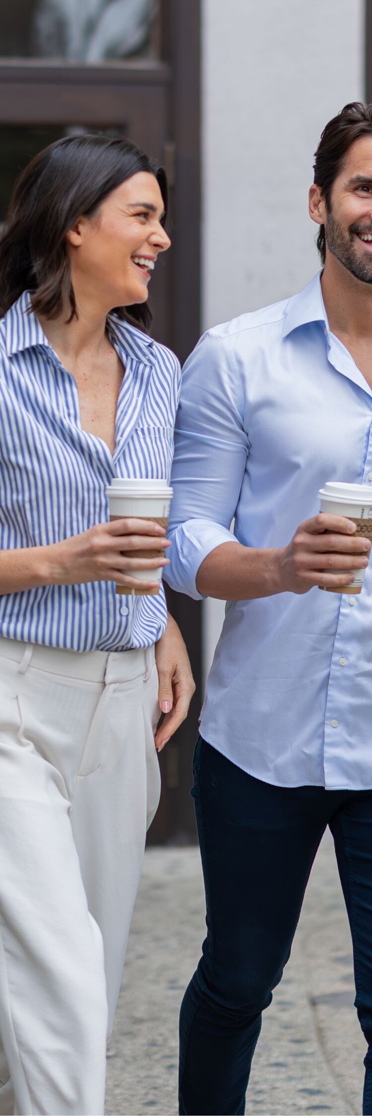 Couple walking with coffee