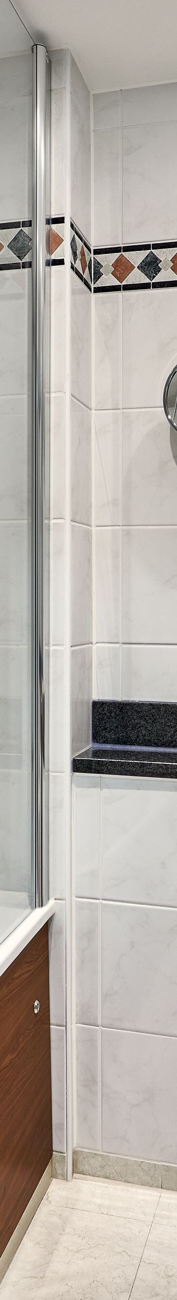 Marble Bathroom with tub shower and sink  