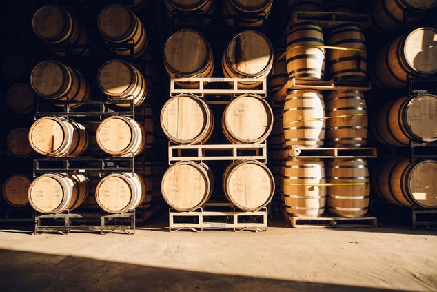 Bourbon barrels in cellar, daytime