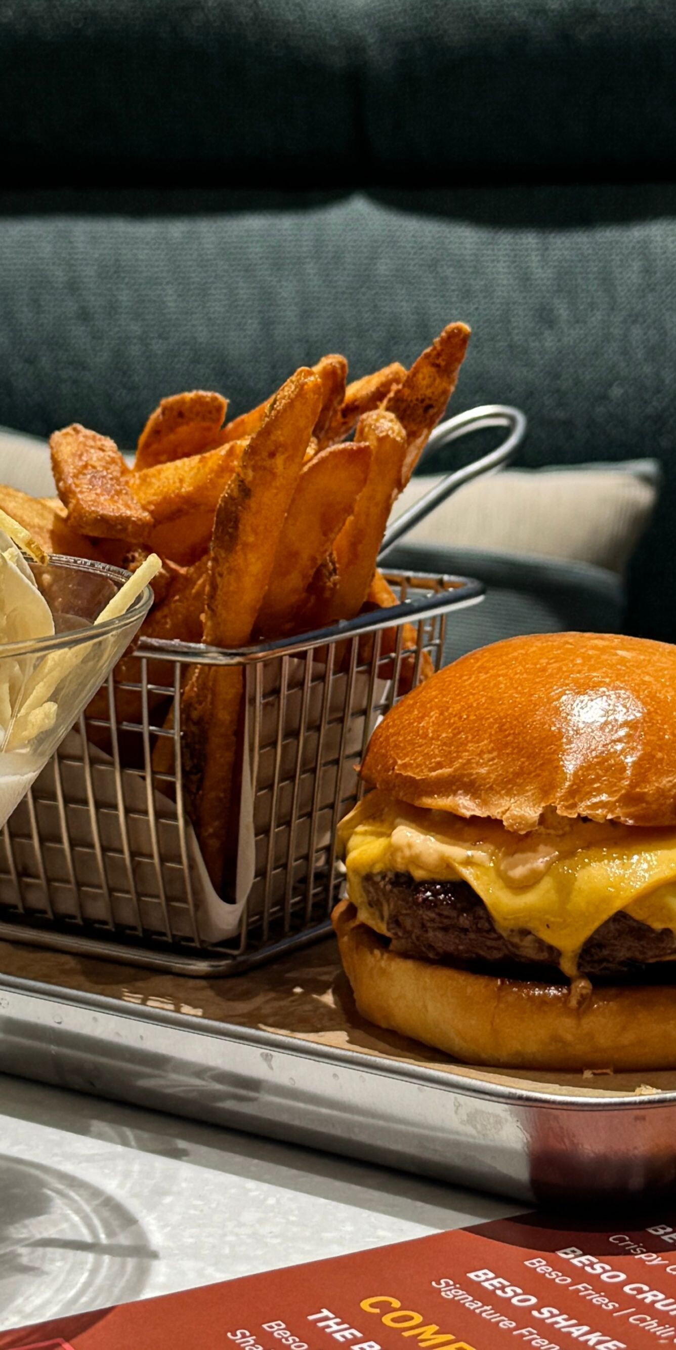 Shake, cheeseburger and fries on tray