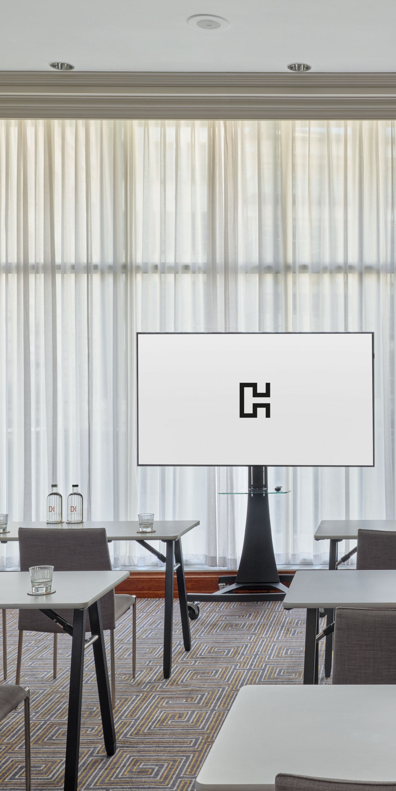 Classroom meeting setup with display screen