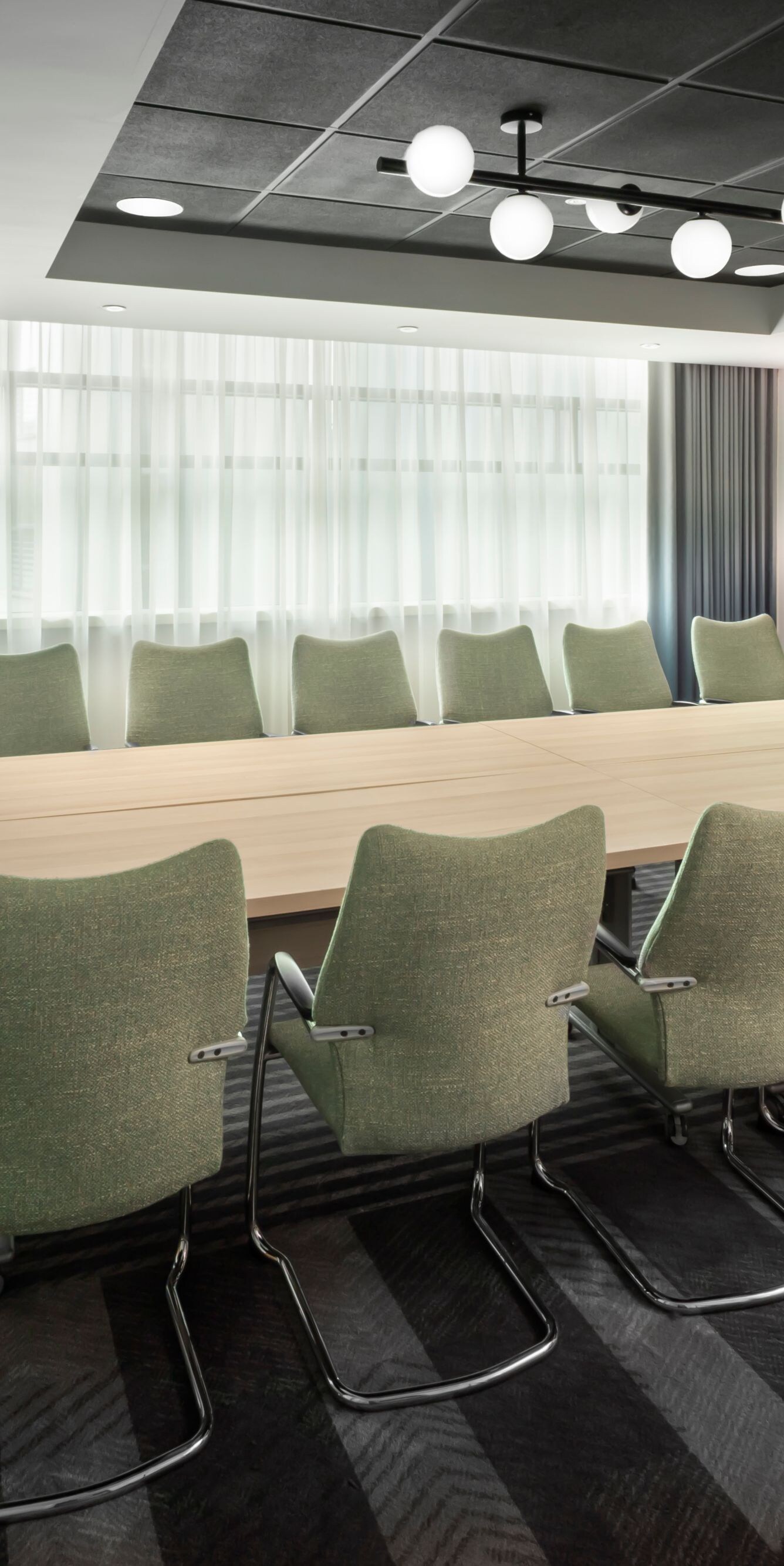 Boardroom with table, chairs and screen