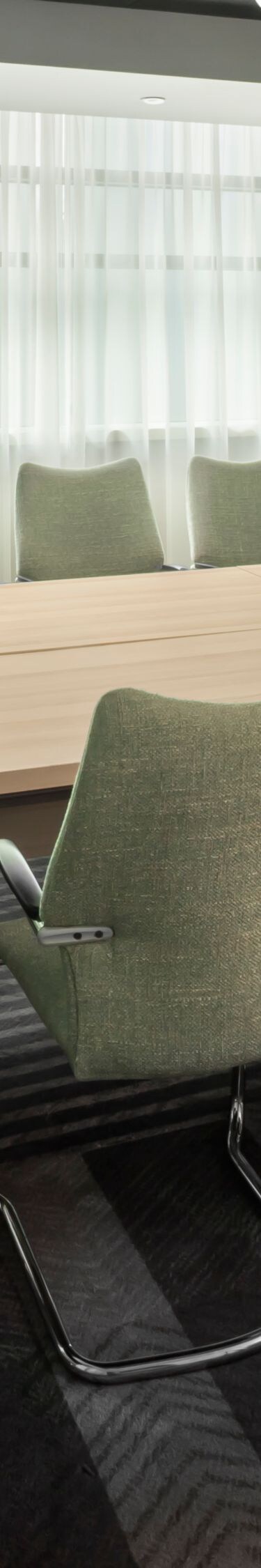 Boardroom with table, chairs and screen