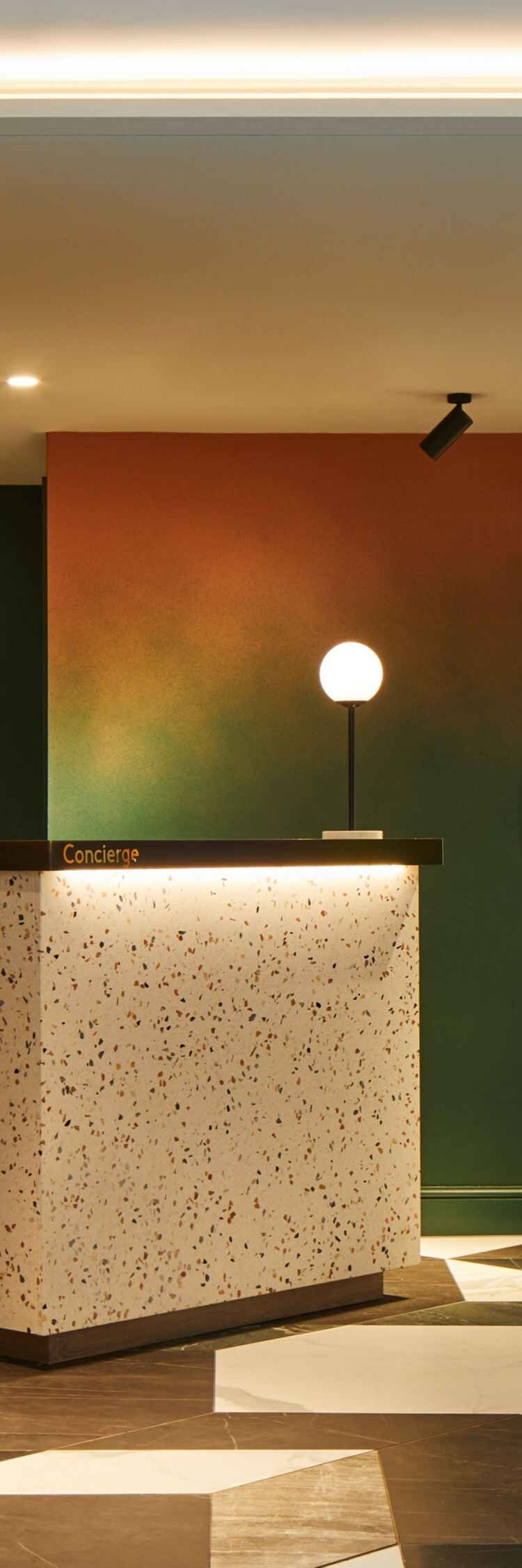 Concierge desk, artwork and seating area
