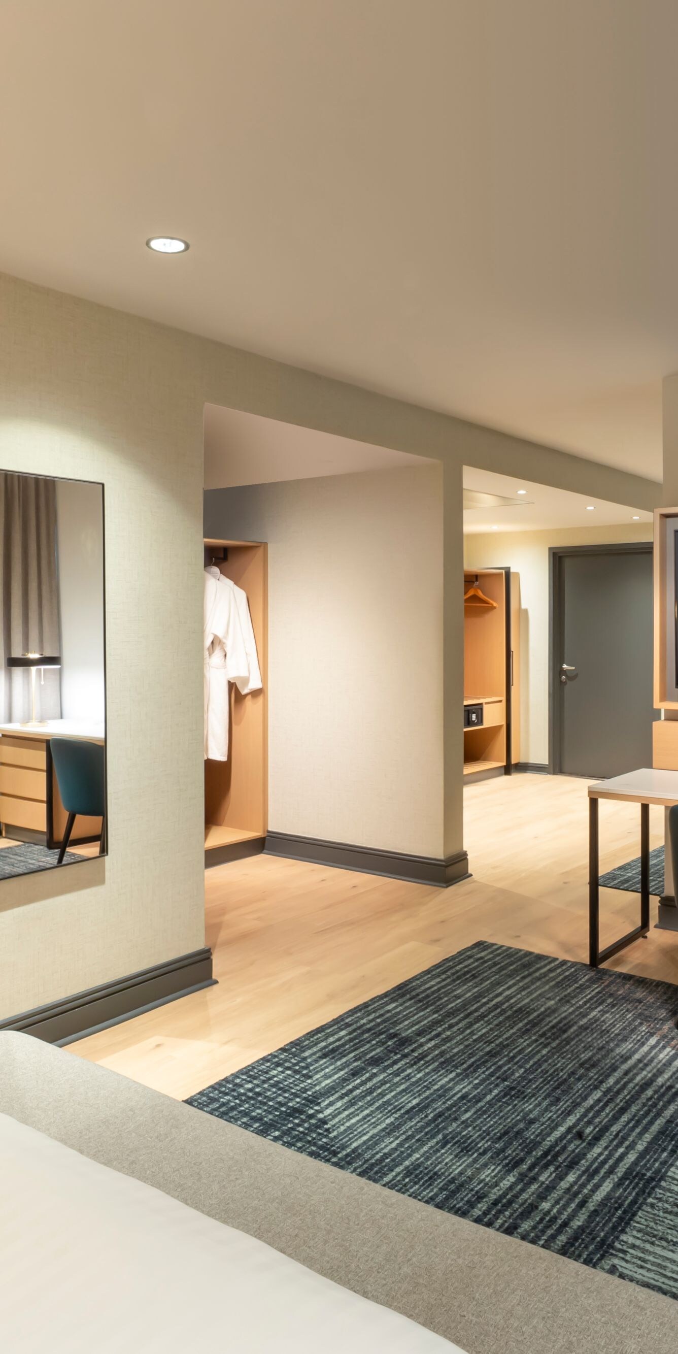 Bedroom with desk, television and wardrobe