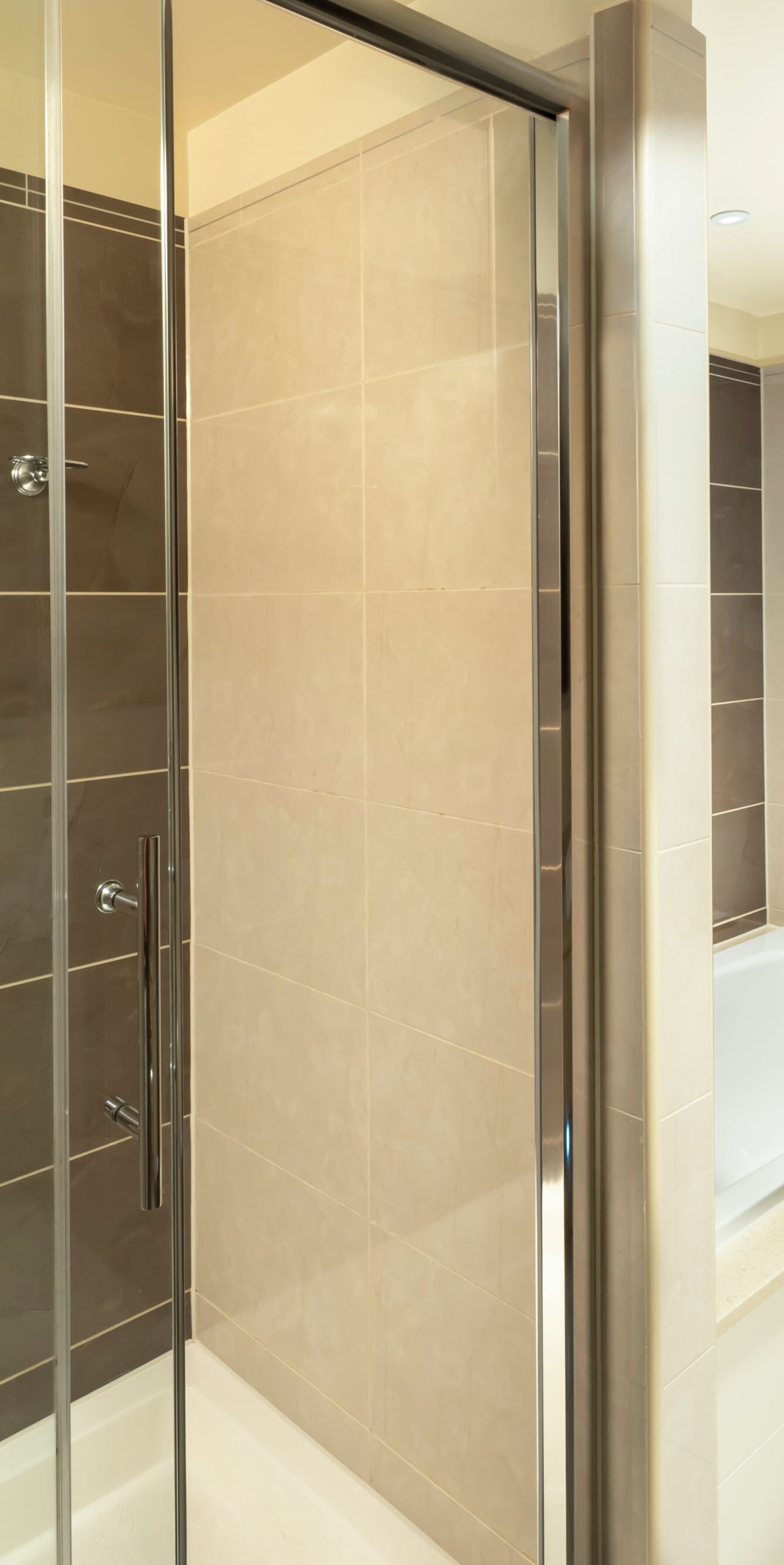 Bathroom with glass shower and bathtub