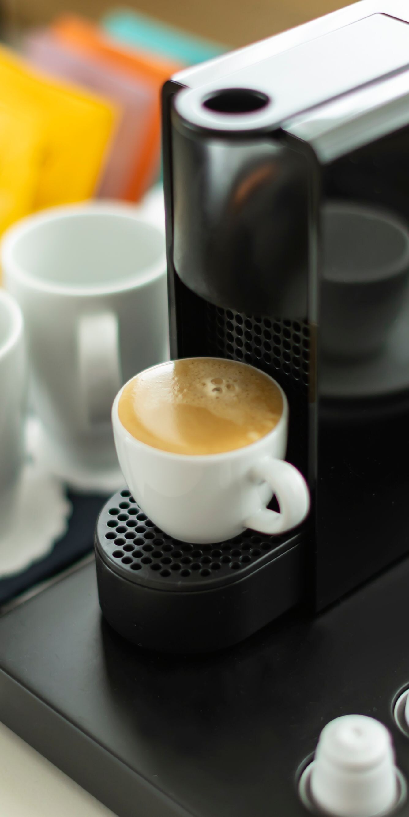 Espresso machine with cups and coffee