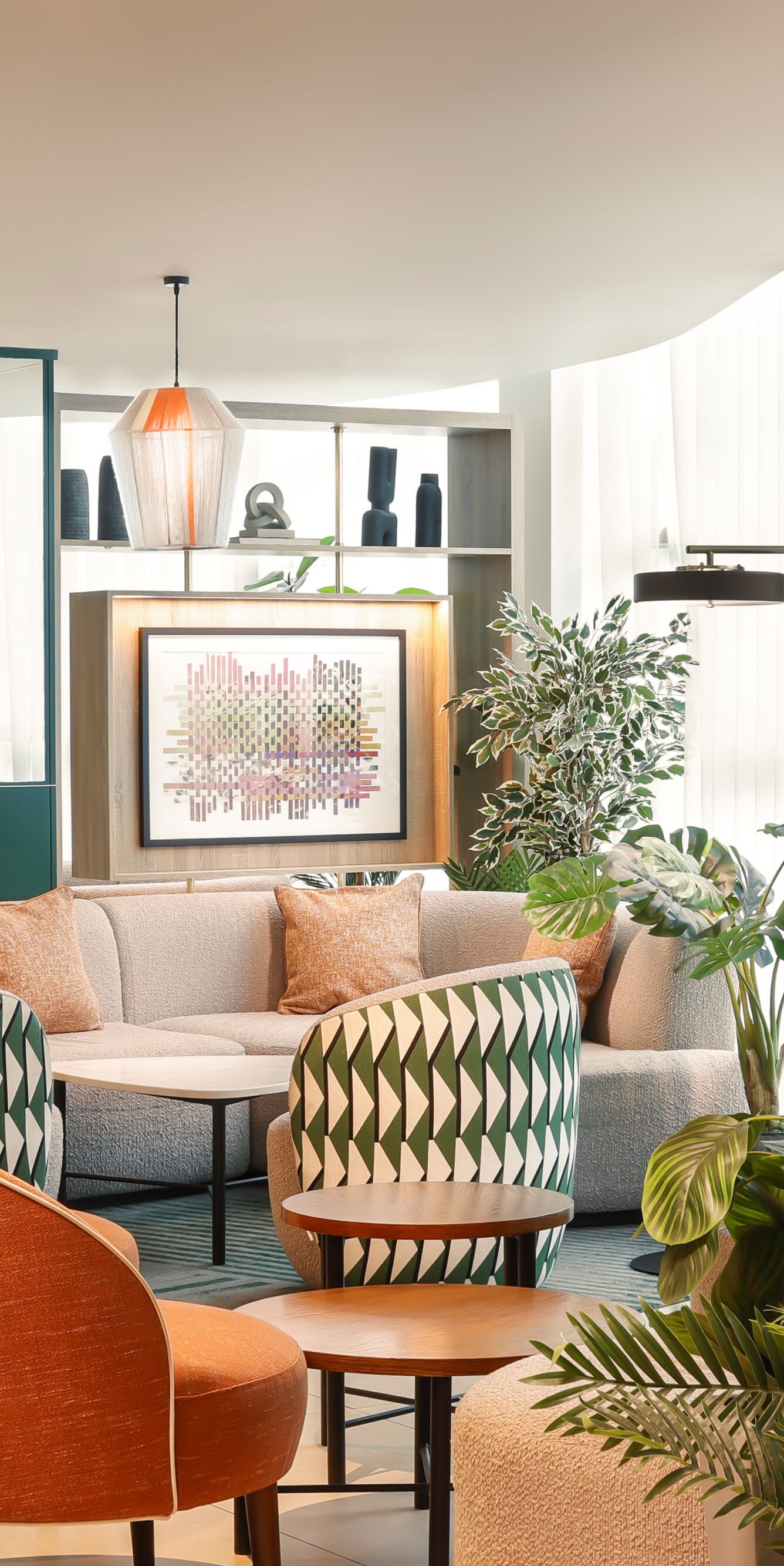 Great Room lounge seating with plants and windows