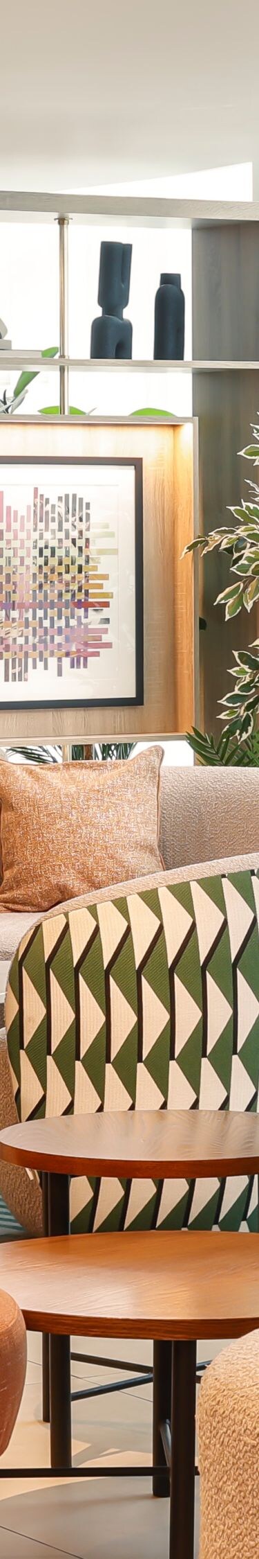Great Room lounge seating with plants and windows