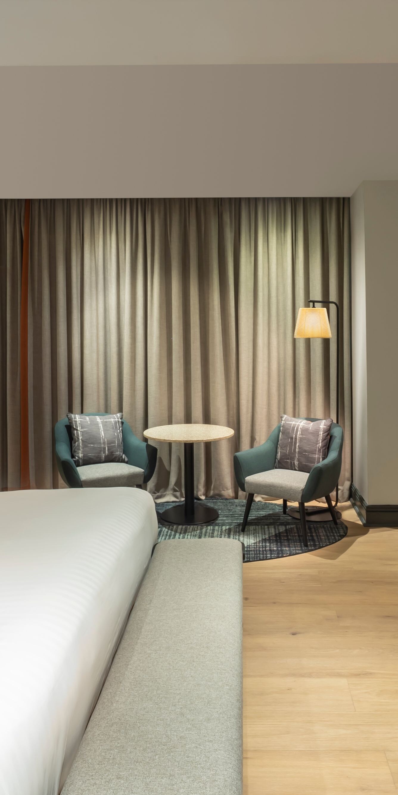 Panoramic bedroom seating and city views
