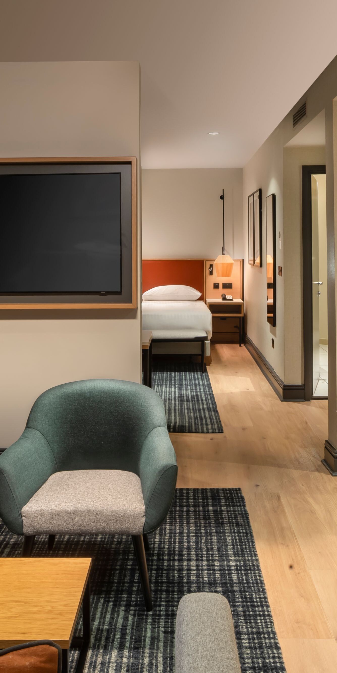 Executive Suite lounge with sofa and television