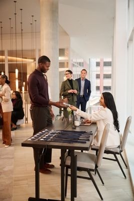 A man checking into a conference