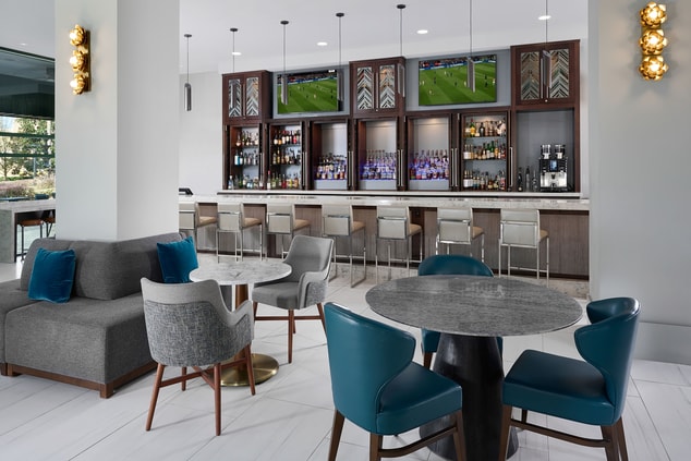 Intimate seating areas next to expansive bar.