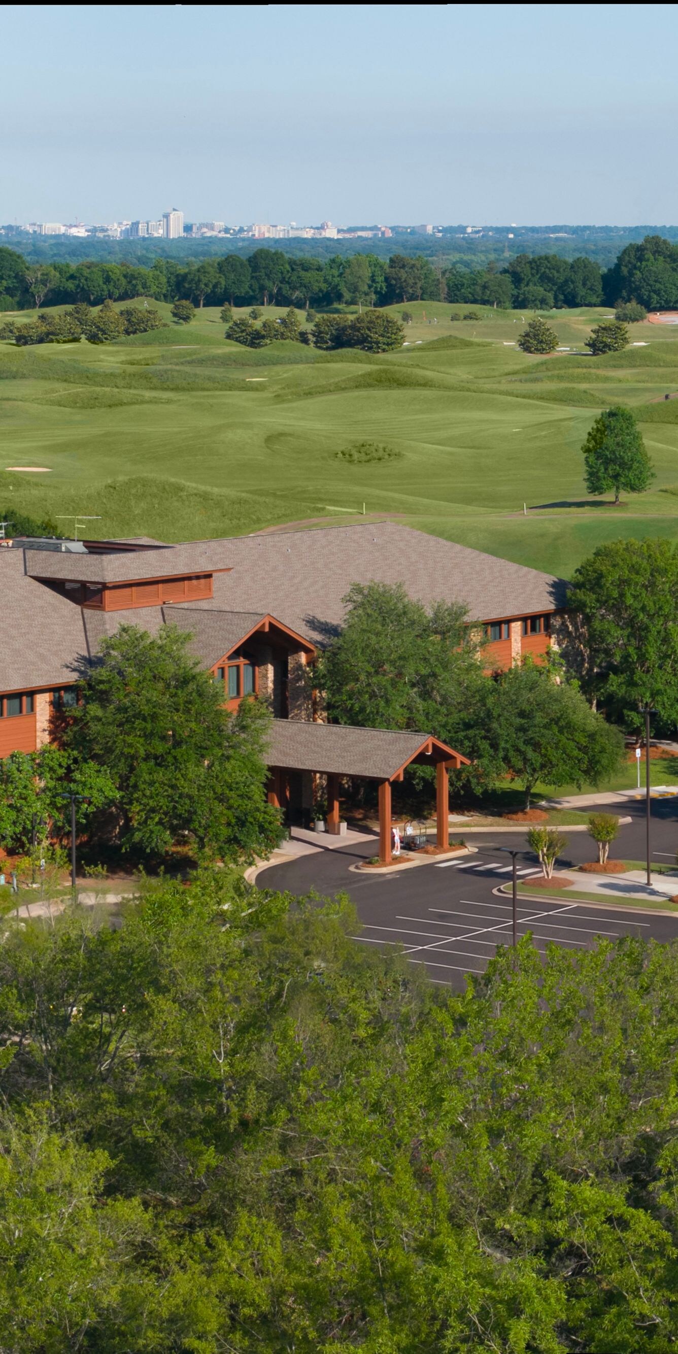 View of hotel exterior, villas, and golf course