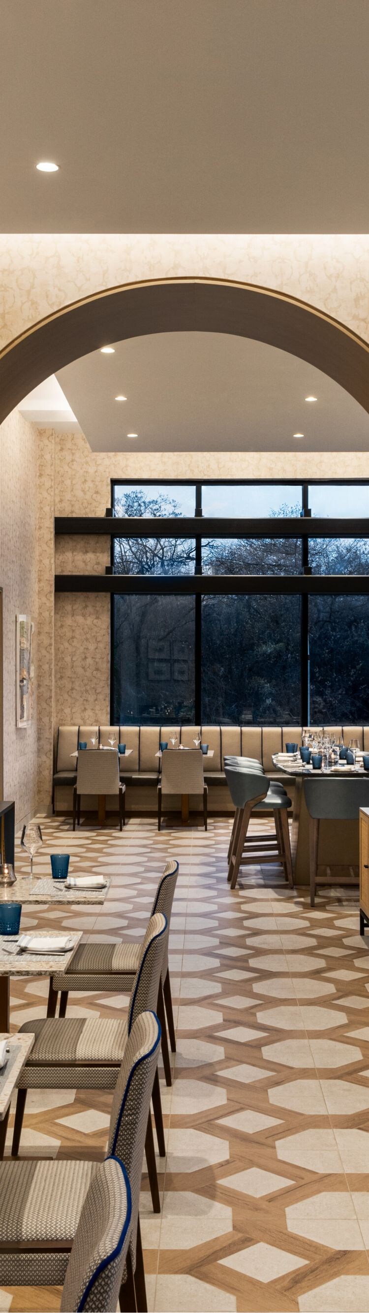 Restaurant with communal table and large arches