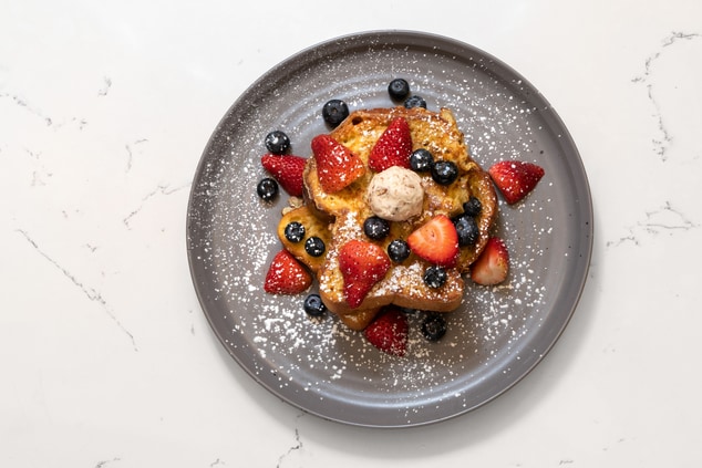 French toast topped with assorted berries