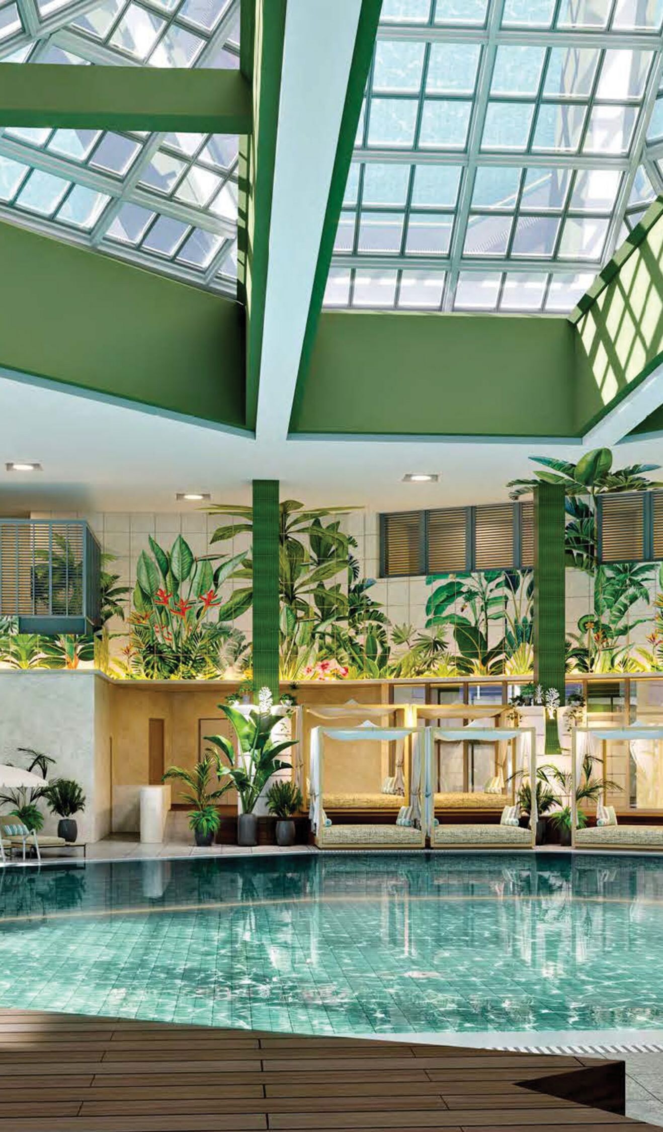 Indoor pool with lounge chairs and tropical plants