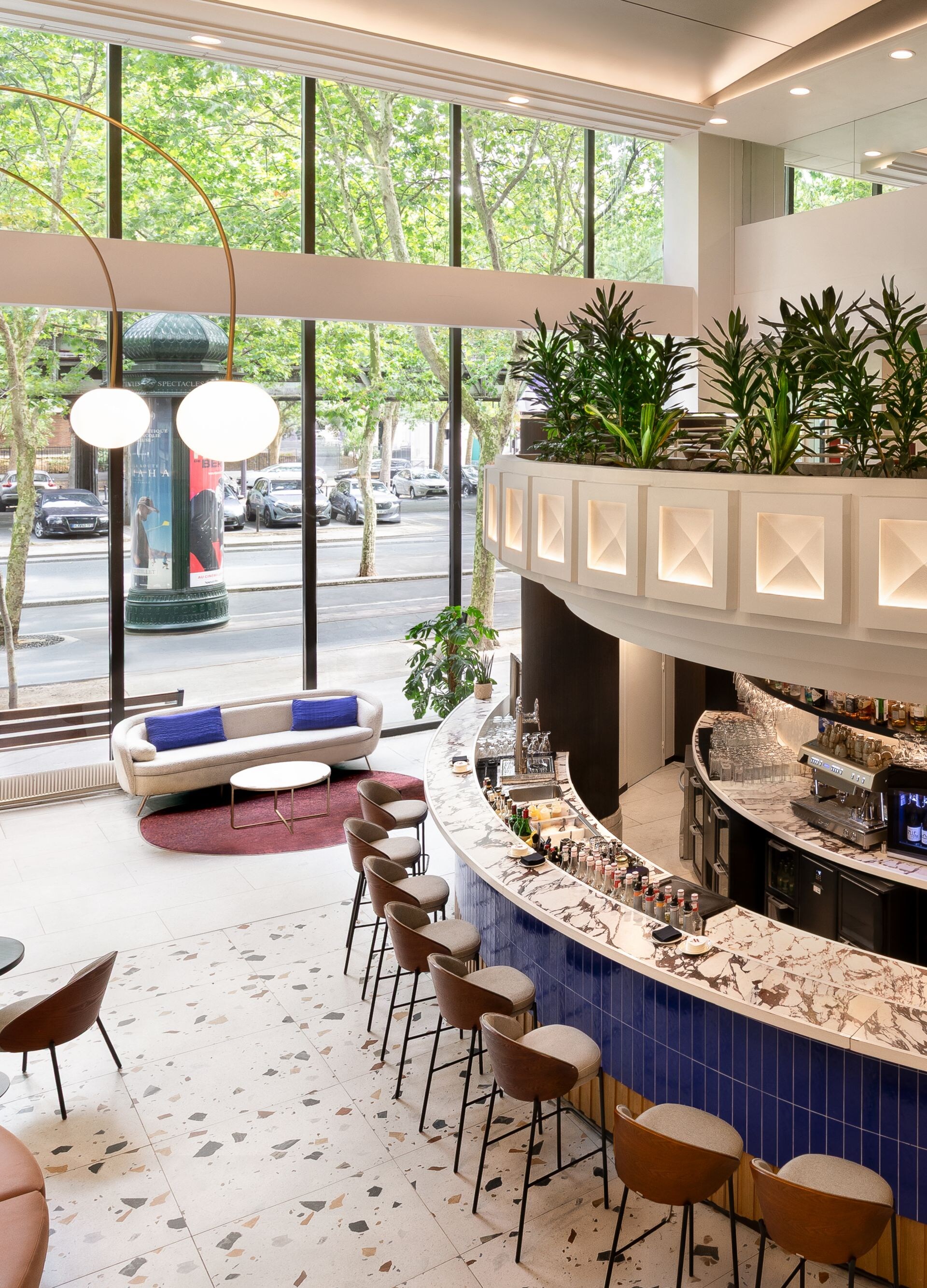 Curved lobby bar with seating and windows