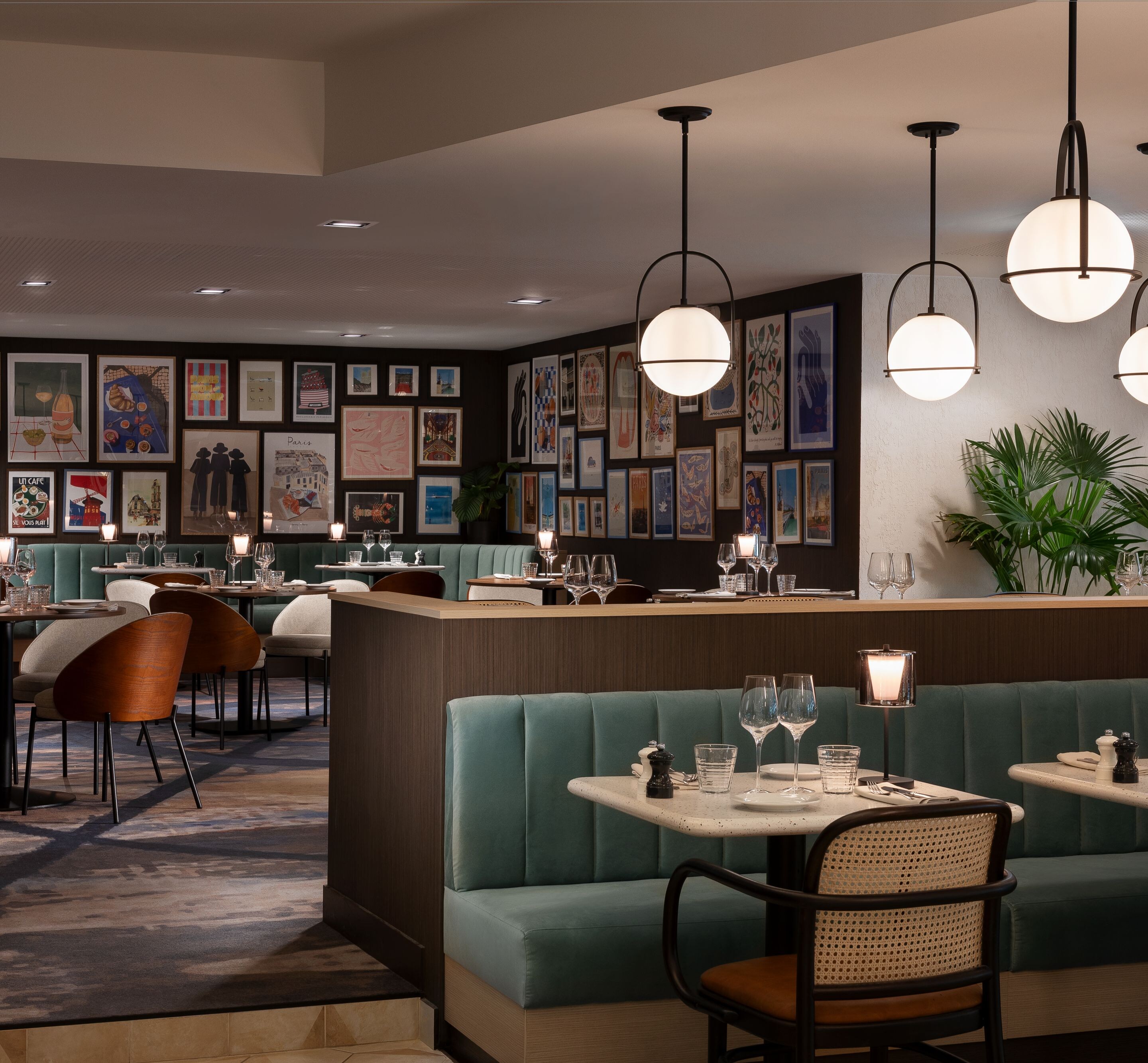 Palyma Bistro seating beside framed gallery wall