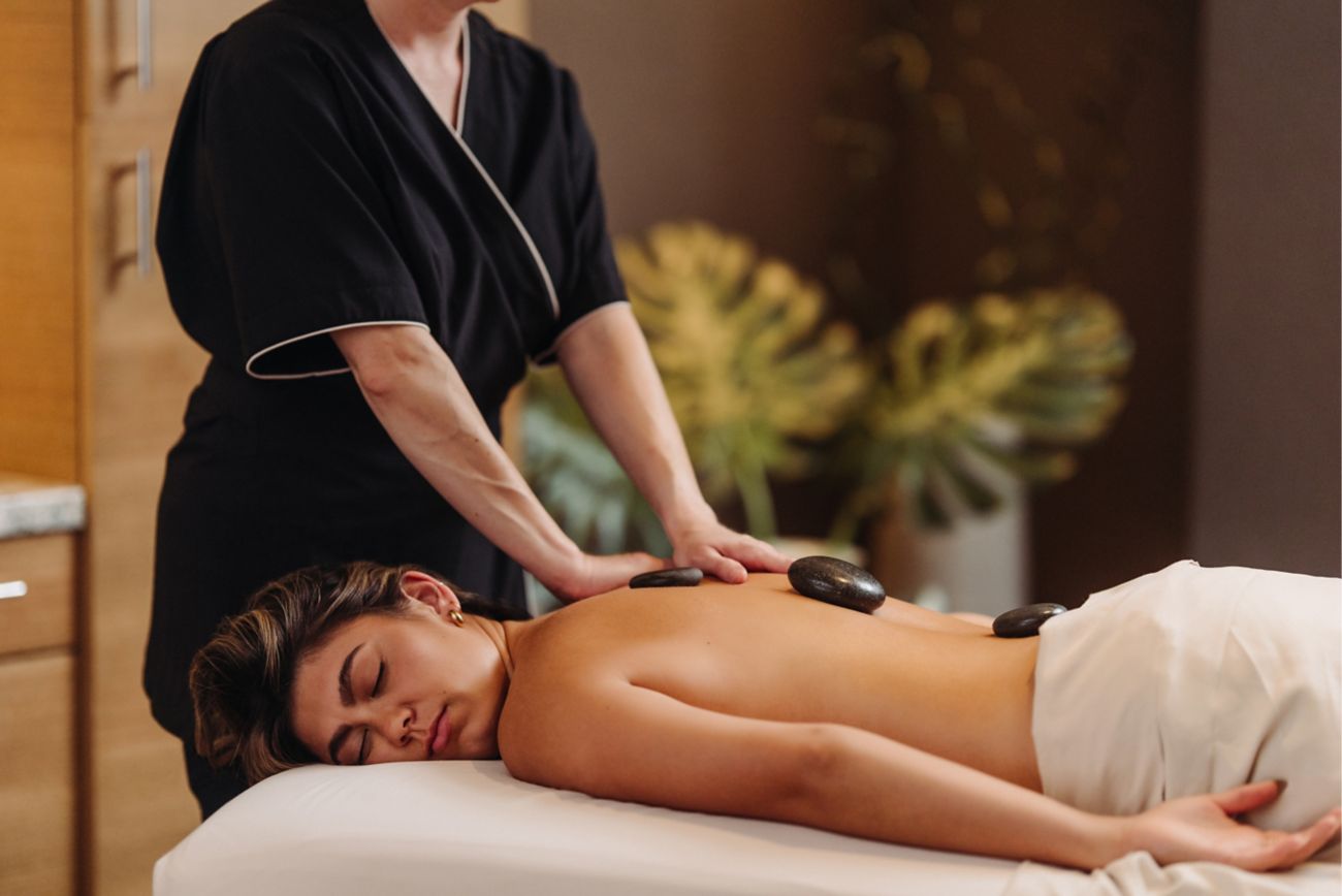 Woman getting a hot stone massage 