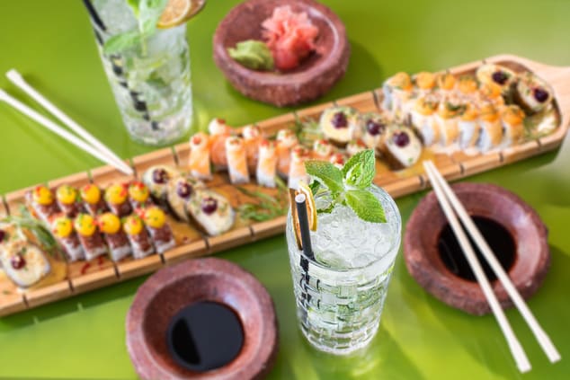 Sushi and drinks on table