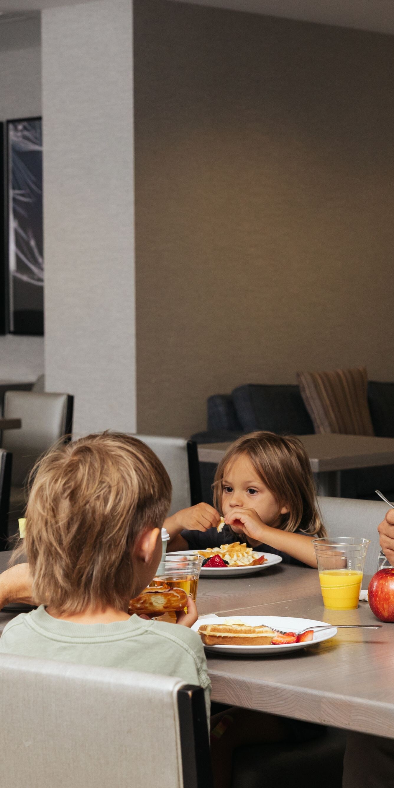 Family eating breakfast in dining area