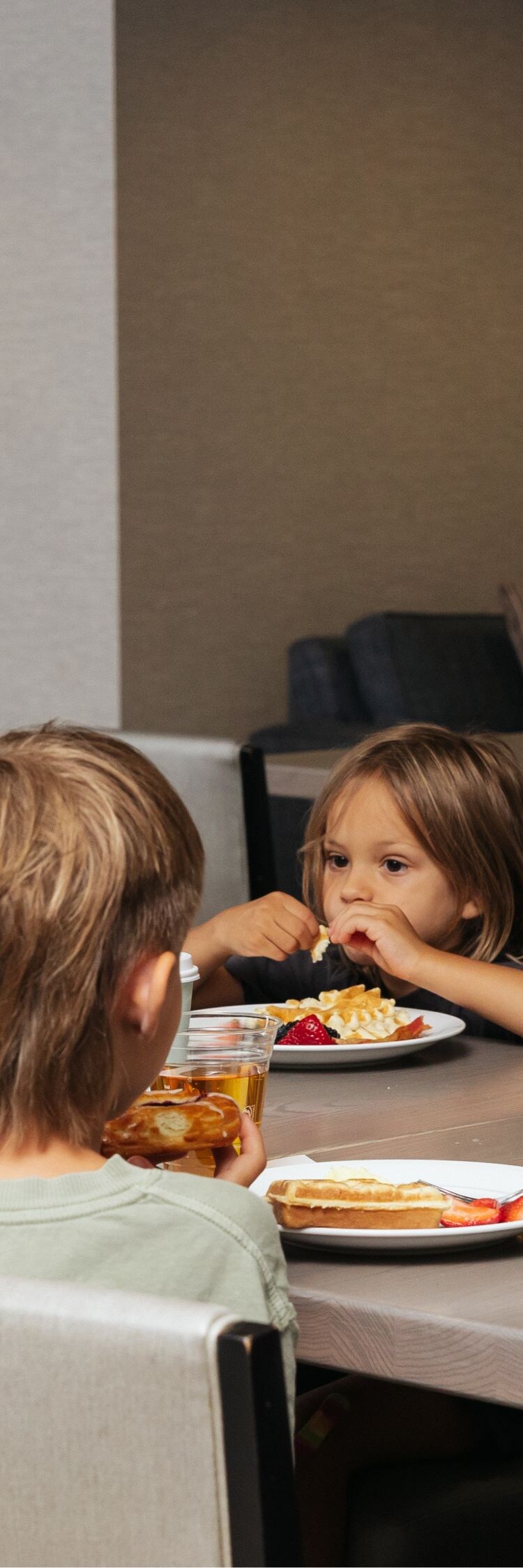 Family eating breakfast in dining area