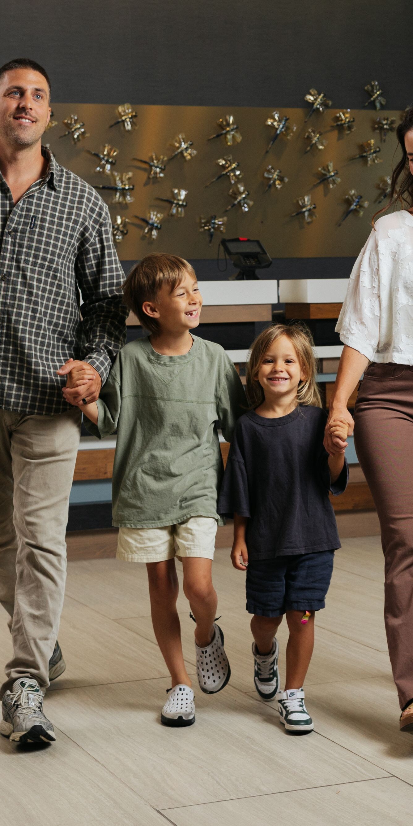 Family with luggage in lobby