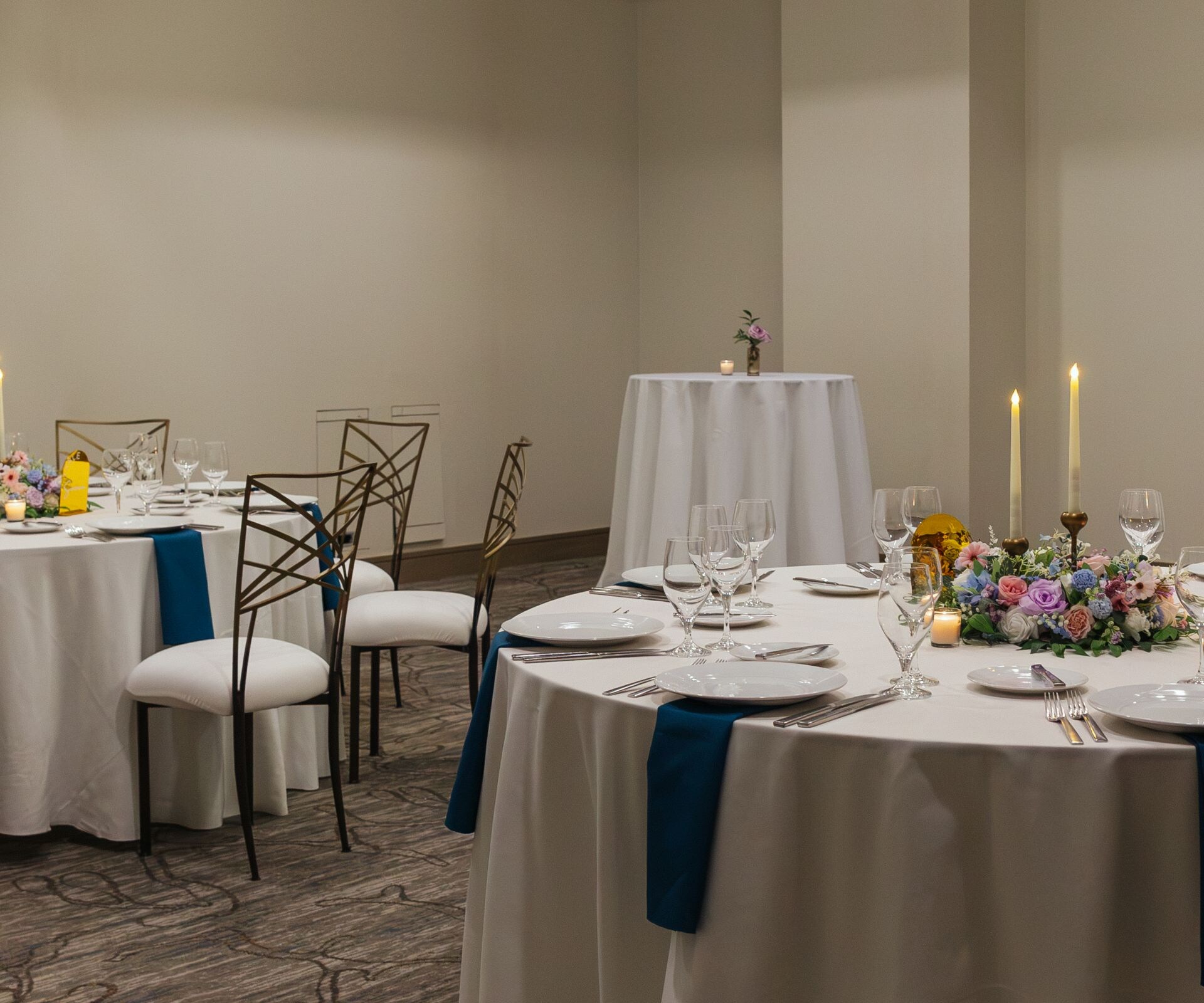 Event space with round tables and decor