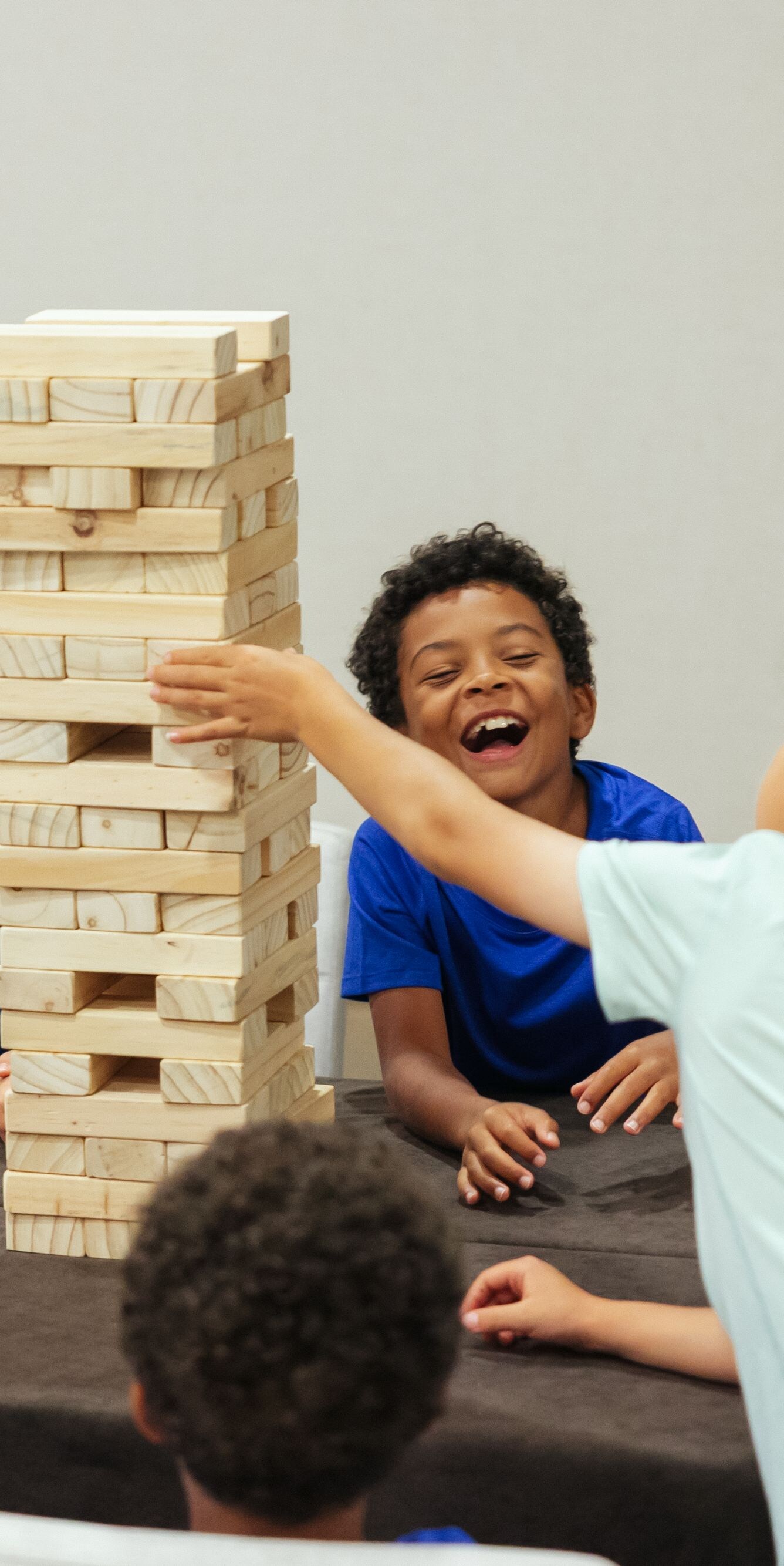 Children playing block stacking game