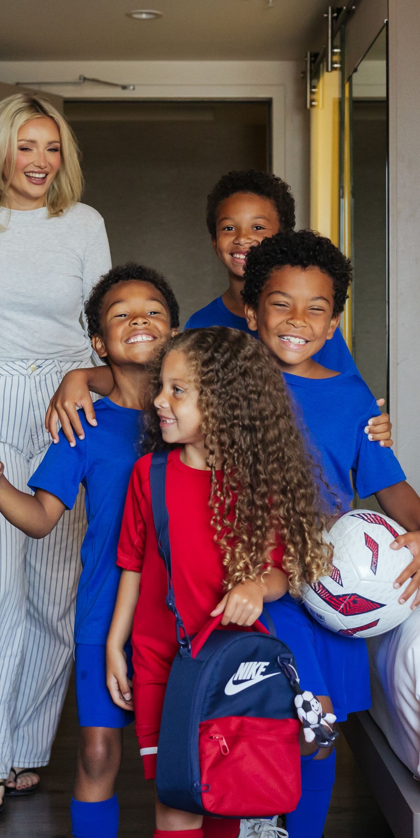 Youth sports team arriving at a hotel room