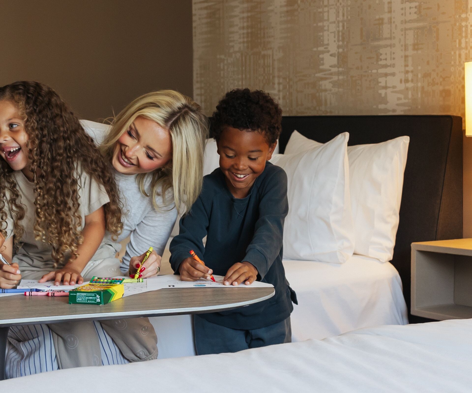 Family coloring in a hotel guest room