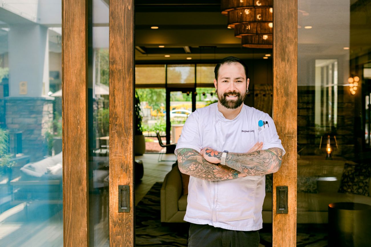 Executive Chef at entrance of restaurant
