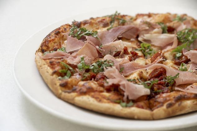 Pizza with toppings available at bin480 