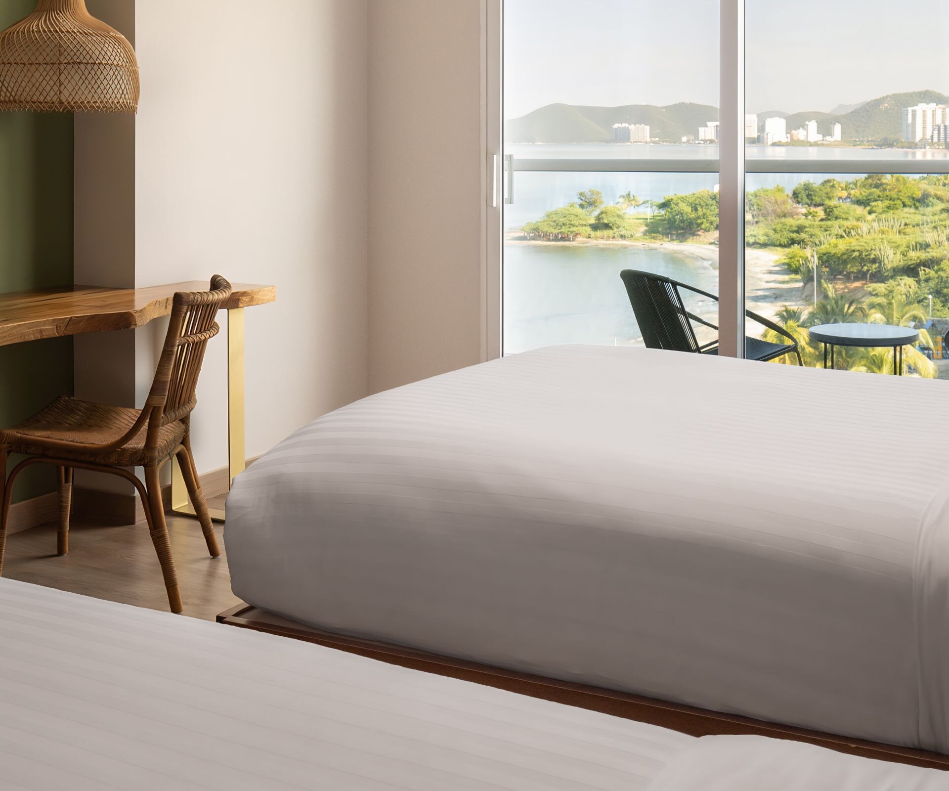 two beds, desk, chair, TV, balcony with view