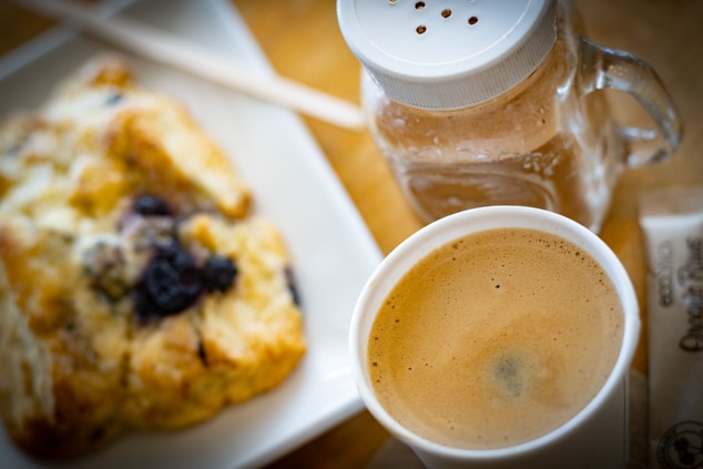 Blueberry scone and espresso drink.