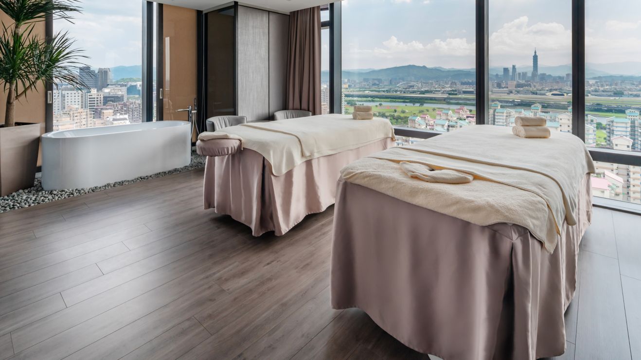 Two massage tables set up in a room. 