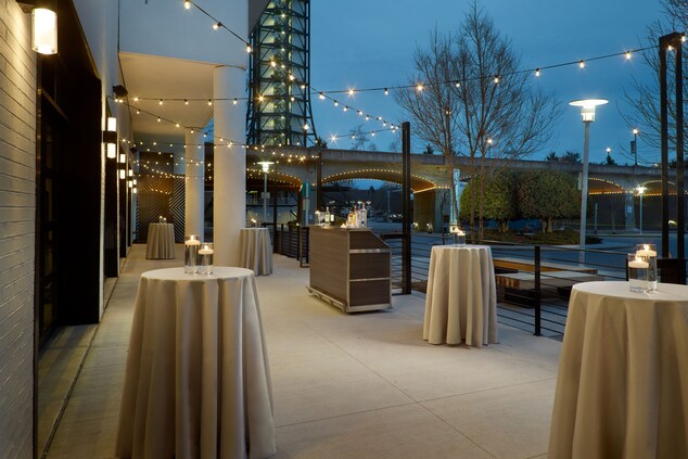 Gallery patio at dusk with social setup