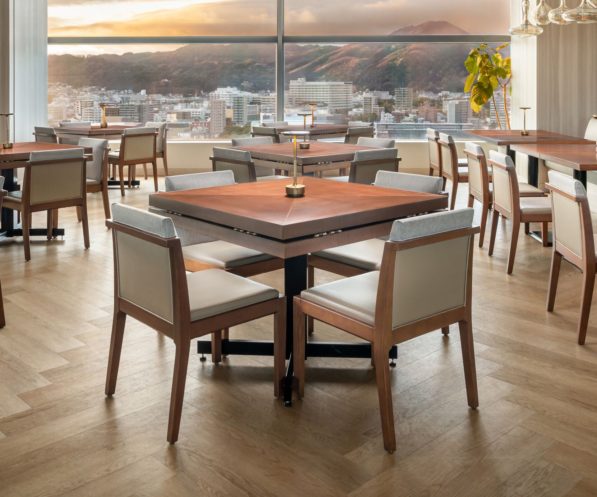 Dining room with tables chairs and city view