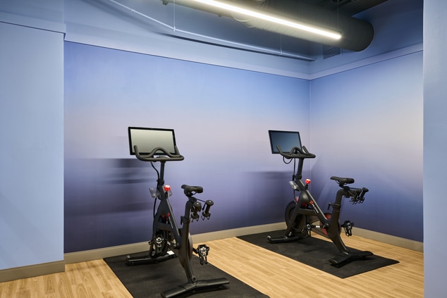 Spacious fitness center with two peloton bikes
