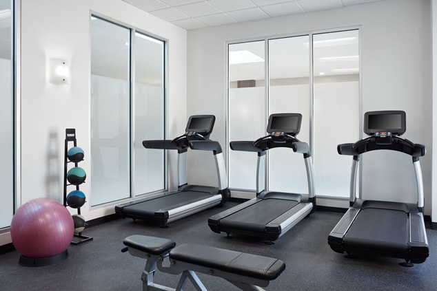 Fitness centre with treadmills and equipment.