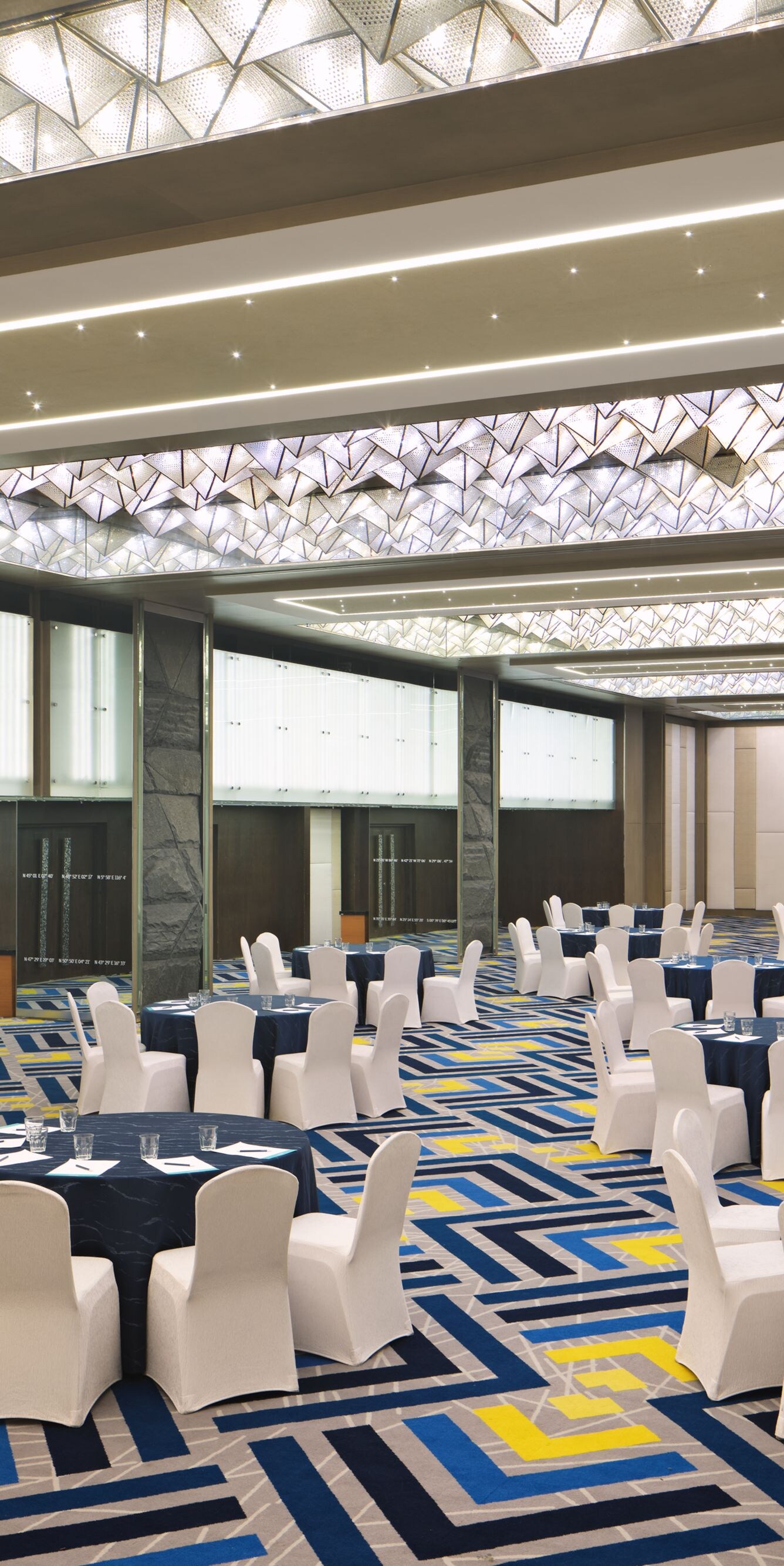 Ballroom with banquet setup and lighting